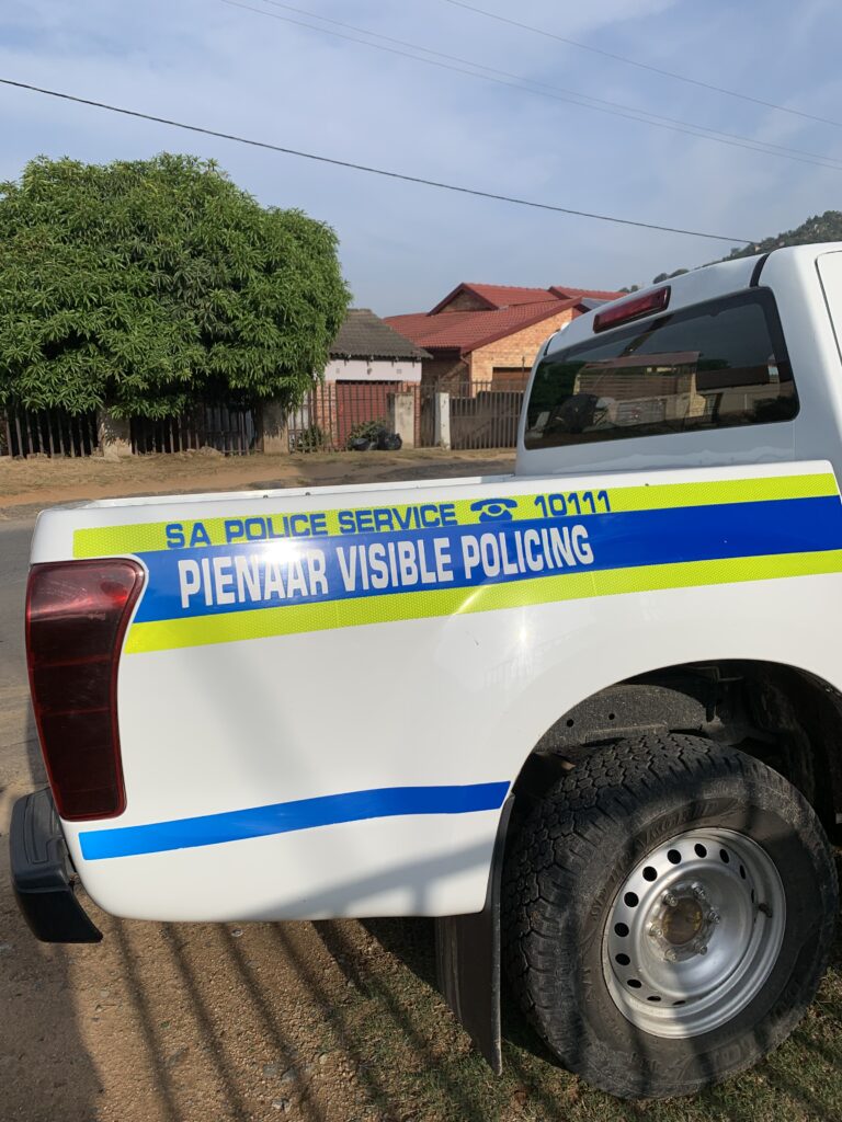 A South African Police Service Visible Policing vehicle parked in a residential street in Pienaar.